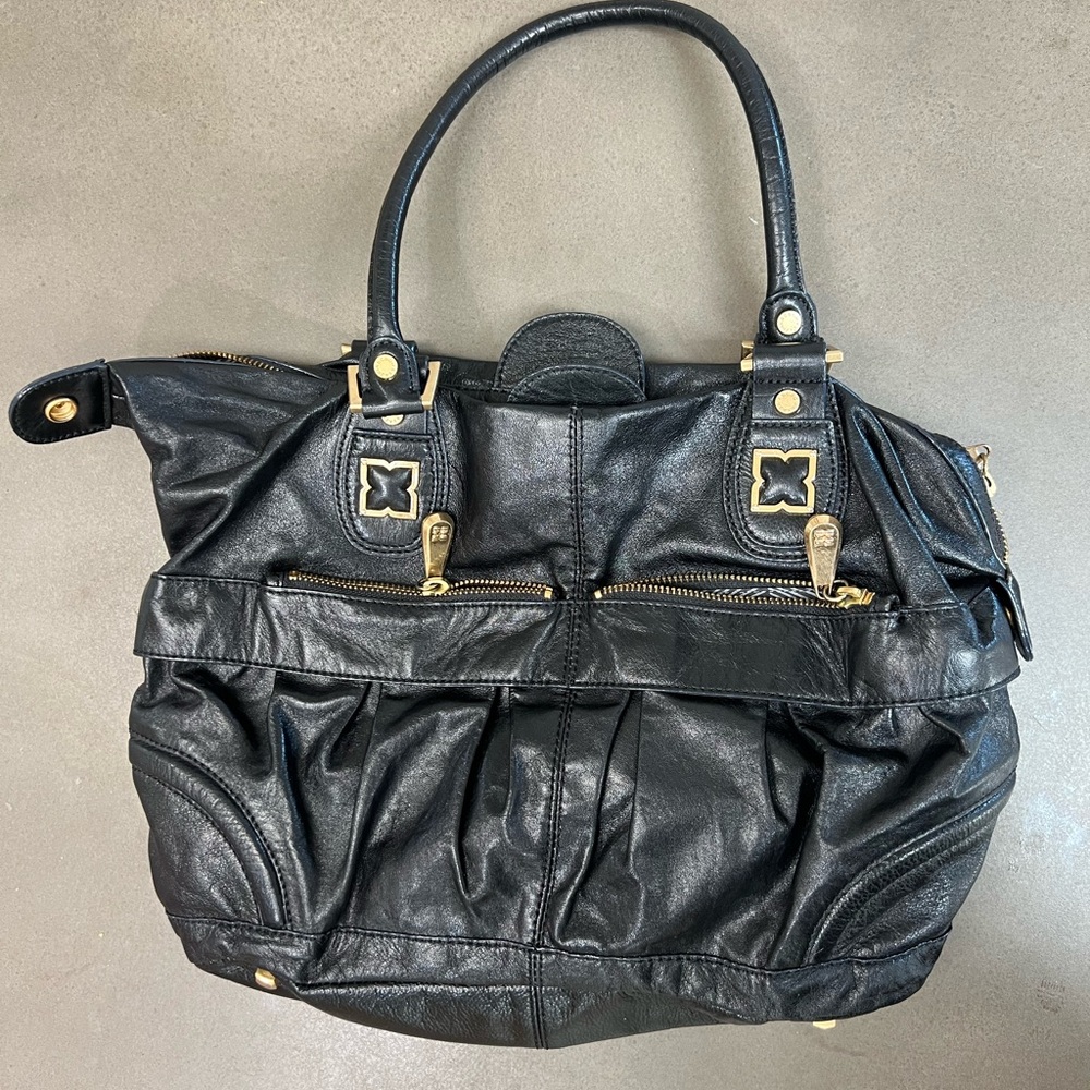 BCBGMaxAzria Black and Gold Shoulder Bag with Slouchy Design